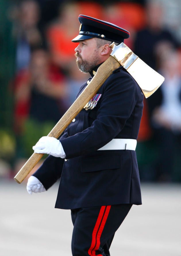 A bearded Pioneer Sergeant (the only soldier in the British Army allowed to wear a beard) carries a Pioneer Axe (the symbol of the Pioneer Regiment) during the 23 Pioneer Regiment RLC Disbandment Parade at St David's Barracks on Sept. 26, 2014 in Bicester, England.