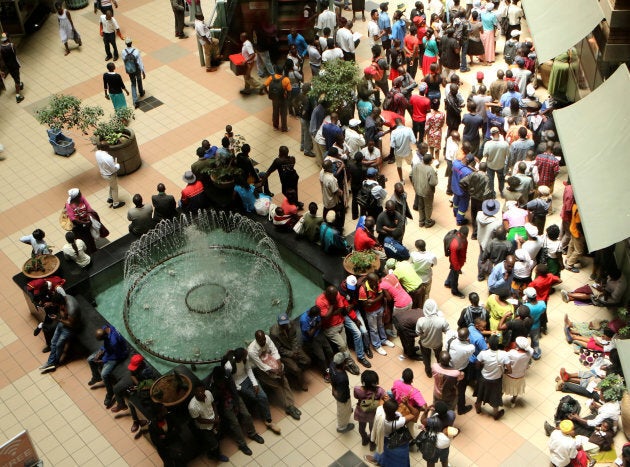 Amidst political uncertainty, Zimbabweans are waiting in long queues to withdraw limited supplies of cash from banks in Harare.