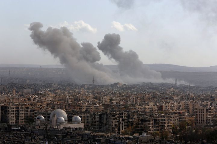 A general view shows rising smoke after strikes on Aleppo city, Syria December 3, 2016