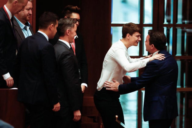 Senator Dean Smith embraces supporters of the Yes campaign after speaking during debate on the Marriage Amendment bill in the Senate