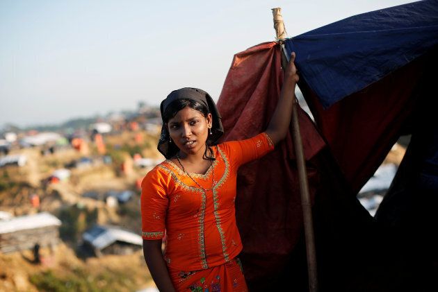 A Rohingya refugee girl stands outside her shelter at Balukhali refugee camp near Cox's Bazar, Bangladesh.
