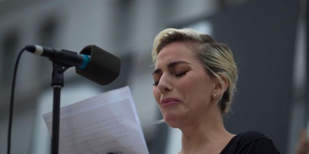 LOS ANGELES, CA - JUNE 13: Singer Lady Gaga tries not to cry while reading some of the names of the dead at a vigil for the worst mass shooing in United States history on June 13, 2016 in Los Angeles, United States. A gunman killed 49 people and wounded 53 others at a gay nightclub in Orlando, Florida early yesterday morning before suspect Omar Mateen also died on-scene. (Photo by David McNew/Getty Images)