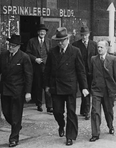 Noel W Lamidey (far right) with politician Arthur Calwell (centre) inspecting ships in the yards