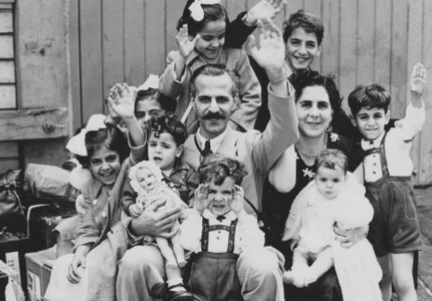 New Australians: Mr and Mrs John Manche with their family of nine children on the wharf at Circular Quay, Sydney, in 1955.