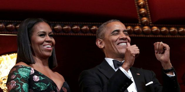 U.S. President Barack Obama gestures as he and first lady Michelle Obama attend the Kennedy Center Honors in Washington, U.S., December 4, 2016. REUTERS/Yuri Gripas