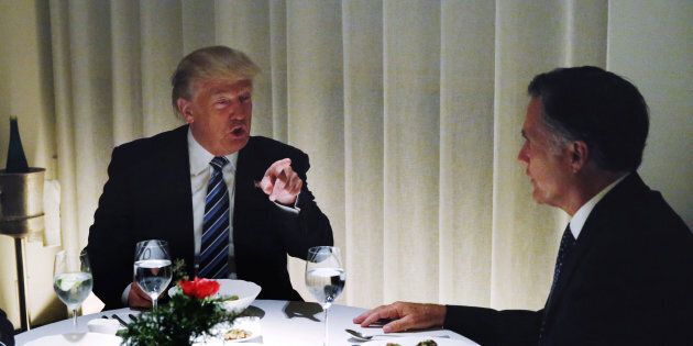 U.S. President-elect Donald Trump sits at a table for dinner with former Massachusetts Governor Mitt Romney (R) at Jean-Georges inside of the Trump International Hotel & Tower in New York, U.S., November 29, 2016. REUTERS/Lucas Jackson