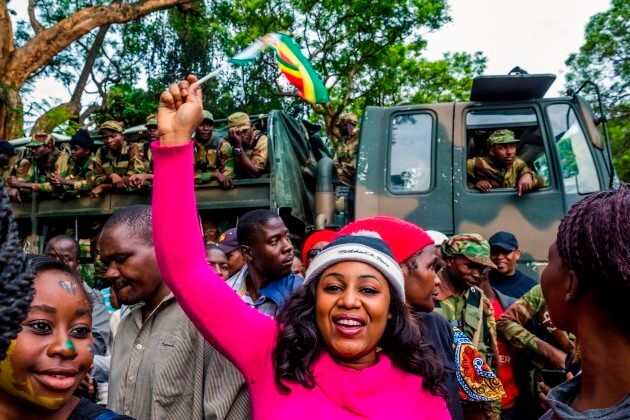 Zimbabwean soldiers block the way to people who demonstrate to demand the resignation of Zimbabwe's president near the State House.
