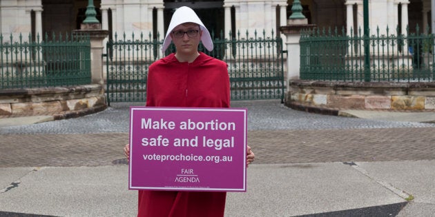 One of Fair Agenda's handmaids, pushing for the decriminalisation of abortion.