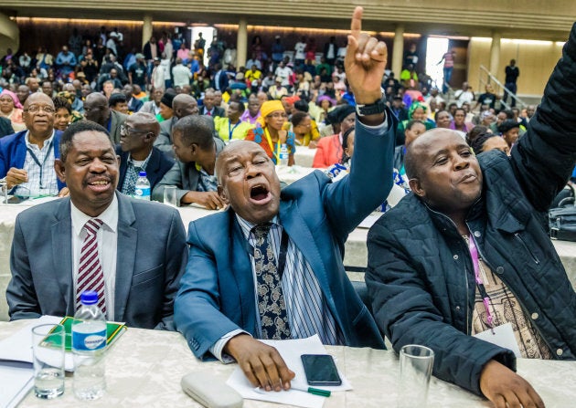 War Veterans leader Christopher Mutsvangwa (centre) celebrates the dismissal of the president of the ruling ZANU-PF party on November 19, 2017 in Harare.