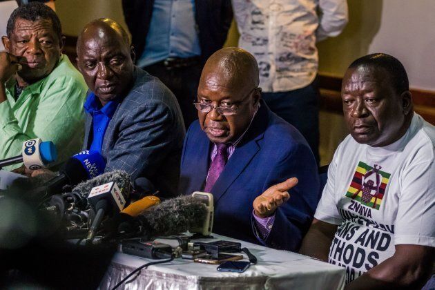 Leader of the Zimbabwe's War Veterans Association Christopher Mutsvangwa (centre) speaks during a press conference in Harare where he called again for Zimbabwe's President Robert Mugabe's resignation on November 20, 2017.