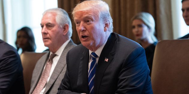 U.S. President Donald Trump speaks as Rex Tillerson, U.S. secretary of state, left, listens during a cabinet meeting at the White House.