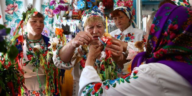 Women gather for a May-time ritual in honour of their pagan god Yurya. For this, villagers don national dress and make offerings out of colourful ribbons and paper in the hope of plentiful harvests in the future.