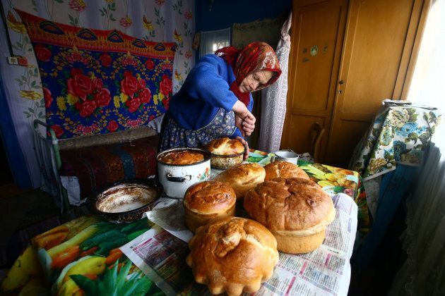 Yulia Panchenya, 82, makes Easter cakes on the eve of Orthodox Easter in the village of Pogost, Belarus.