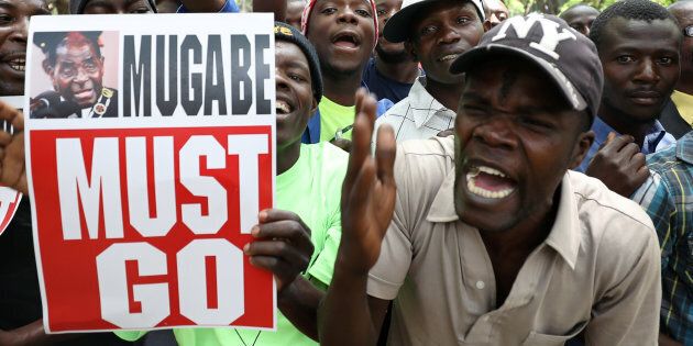 Protesters call for Zimbabwean President Robert Mugabe to resign.