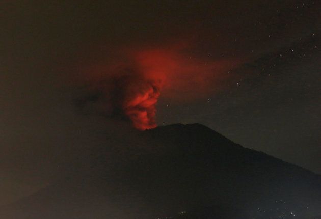 Mount Agung volcano is seen erupting from Glumpang village, Karangasem.