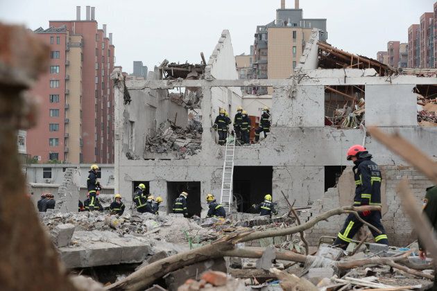 Rescue workers work at the site of a blast in Ningbo.