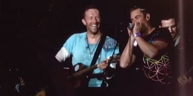 Shane Warne and Chris Martin jammed at last night's Coldplay concert.