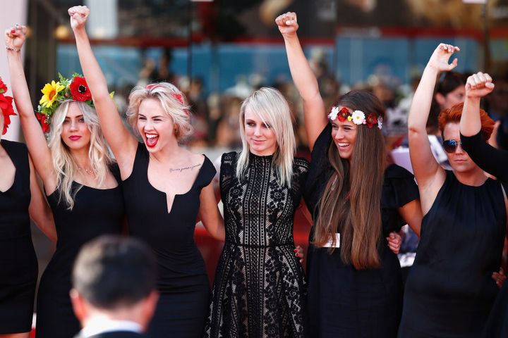 Director Kitty Green and fellow activists from 'Ukraine Not A Model' at the 70th Venice International Film Festival.