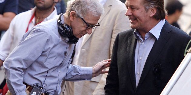 U.S. director Woody Allen (L) talks with Alec Baldwin during the shooting of his next movie