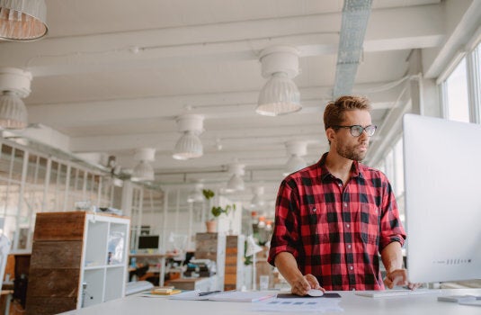 It's not unusual for offices to provide work spaces where people can use a standing desk.