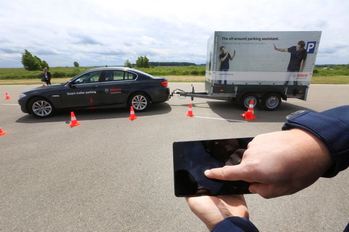 A Bayerische Motoren Werke AG (BMW) automobile is parked via a mobile device remote control during a smart trailer parking demonstration in Boxberg, Germany.