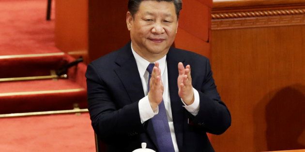 Chinese President Xi Jinping applauds after the parliament passed a constitutional amendment lifting presidential term limits, at the third plenary session of the National People's Congress (NPC) at the Great Hall of the People in Beijing, China March 11, 2018.