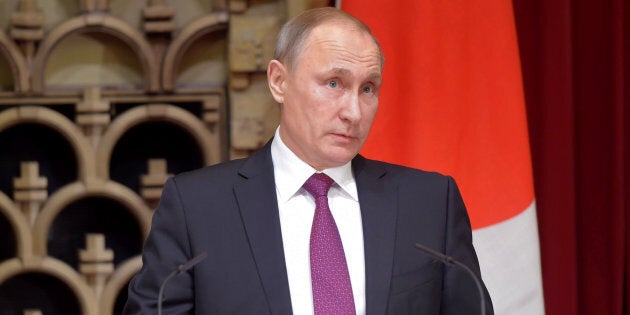 TOKYO, JAPAN - DECEMBER 16: Russian President Vladimir Putin speaks during a press conference following the talks with Japan's Prime Minister Shinzo Abe (not pictured) on December 16, 2016 in Tokyo, Japan. (Photo by Dmitry Azarov/Kommersant via Getty Images)