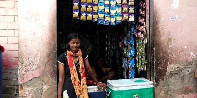 Krishna works as an Internet Saathi in Basai Nawab, near Dholpur, teaching other villagers how to use the Internet. She agreed to have her picture taken along with her shop, which she set up with her earnings as an Internet Saathi.