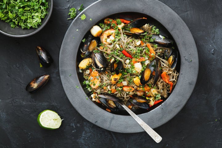 Garnish with herbs and lime.