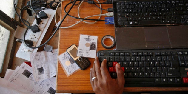 An operator works on his table while enrolling villagers for the Unique Identification (UID) database system at an enrolment centre in Rajasthan.