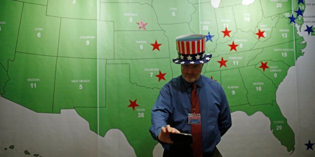 A man takes a selfie in front of the Electoral College Map during a U.S. Election Watch event hosted by the U.S. Embassy at a hotel in Seoul, South Korea, November 9, 2016. REUTERS/Kim Hong-Ji
