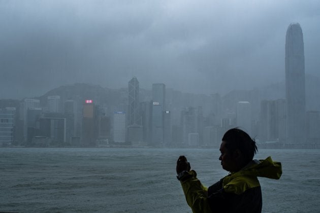 A man takes photos during the approach of super Typhoon Mangkhut to Hong Kong.