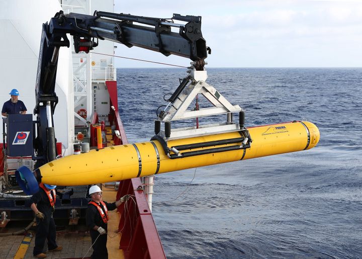 An Autonomous Underwater Vehicle is craned over the side of Australian Defence Vessel Ocean Shield in the search for MH370
