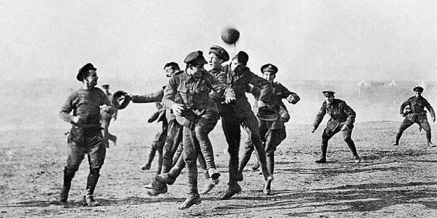 Soldiers play football in No-Man's Land during the Christmas Truce of 1914