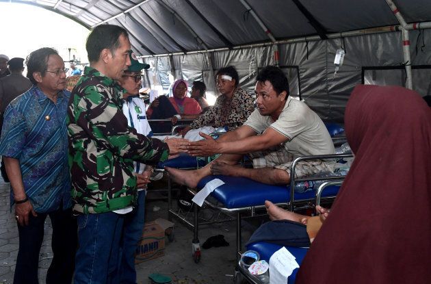 Indonesian President Joko Widodo, accompanied by Central Sulawesi Governor Longki Djanggola, visits people injured by the earthquake and tsunami in Palu, Sulawesi, Indonesia September 30, 2018 in this photo taken by Antara Foto. Via Reuters