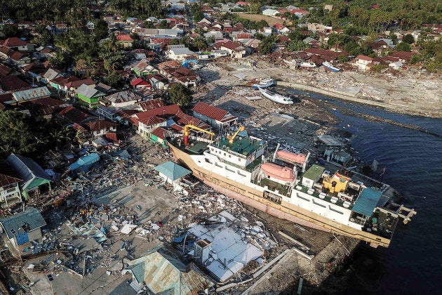 A ship is seen stranded on the shore after an earthquake and tsunami hit the area in Wani, Donggala, Central Sulawesi, Indonesia October 1, 2018 in this photo taken by Antara Foto. Antara Foto/Muhammad Adimaja/ via REUTERS