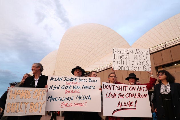 A large crowd gather to protest against racing advertising on the Opera House sails.