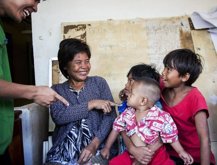 Thol with her children after her sight was restored.