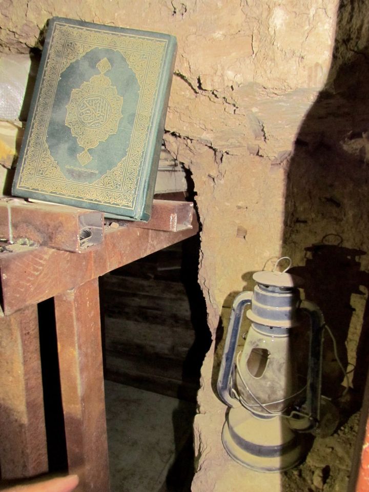 The Holy Quran and a lamp inside one of the tunnels.