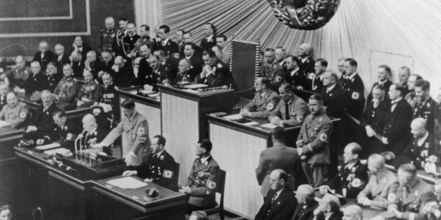 Hitler addresses the Reichstag in Berlin in 1938. Anton Reinthaller is in the first row, fifth from left, according to a caption provided by Getty.