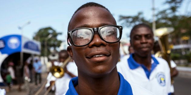 Ebola survivor Musa Pabai walks in an Ebola Survivors Valentine's Day parade in Monrovia.