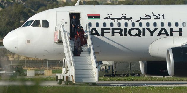 An Afriqiyah Airways aircraft is pictured at the Tripoli Airport , August 25, 2011. REUTERS/Louafi Larbi (LIBYA - Tags: TRANSPORT CONFLICT)