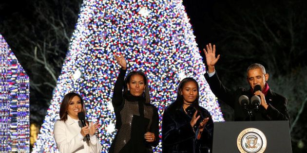 U.S. President Barack Obama (R), joined by first lady Michelle Obama (2nd L), their daughter Sasha (2nd R) and emcee Eva Longoria (L), reacts after pressing a button to light the National Christmas Tree in Washington, U.S. December 1, 2016. REUTERS/Jonathan Ernst