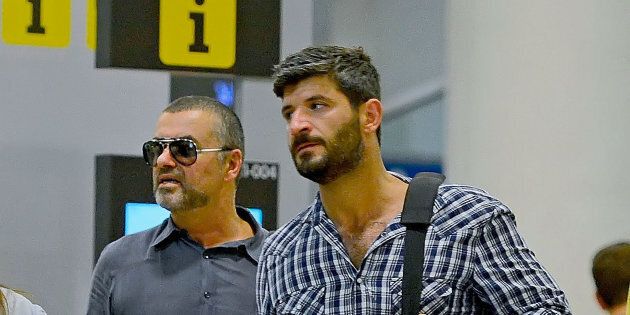BARCELONA, SPAIN - JULY 29: George Michael and his boyfriend Fadi Fawaz are seen at Barcelona El Prat Airport on July 29, 2012 in Barcelona, Spain. (Photo by Bauer-Griffin/GC Images)