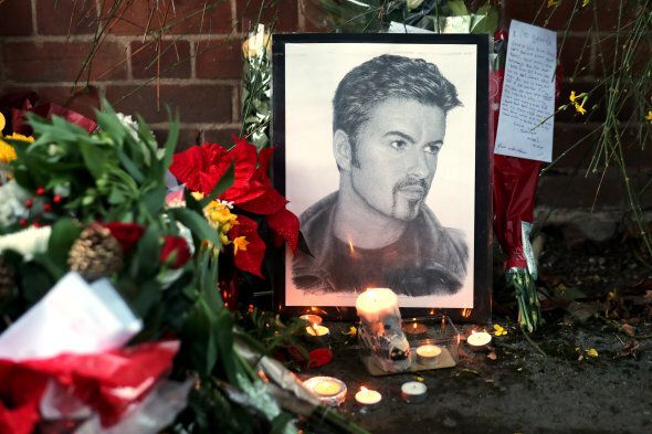 Tributes are seen outside the house of singer George Michael, where he died on Christmas Day, in Goring, southern England, Britain December 26, 2016. REUTERS/Eddie Keogh