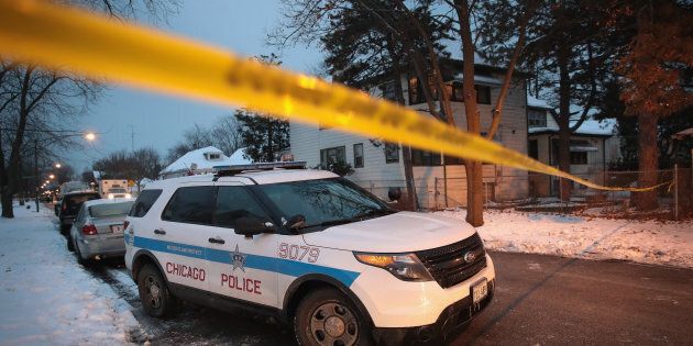CHICAGO, IL - DECEMBER 17: Police investigate the scene of a quadruple homicide on the city's Southside on December 17, 2016 in Chicago, Illinois. Three people were found shot to death inside a home in the Fernwood neighborhood, another 2 were found shot outside the home, one of those deceased. Chicago has had more than 750 homicides in 2016. (Photo by Scott Olson/Getty Images)