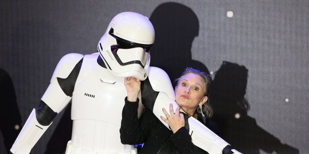 Carrie Fisher poses for cameras as she arrives at the European Premiere of Star Wars, The Force Awakens in Leicester Square, London, December 16, 2015. REUTERS/Paul Hackett/File Photo