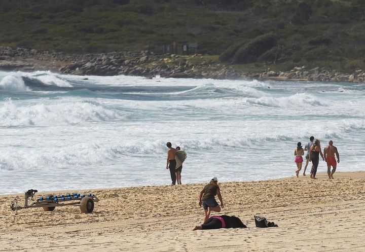 A woman, believed to be the mother of the 14 year old boy who went missing at Maroubra Beach on Tuesday, collapses on Maroubra Beach. The search continues.