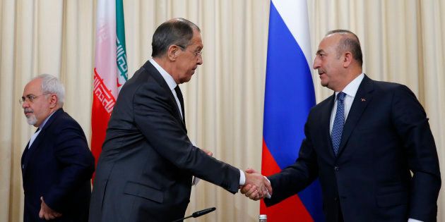 Foreign ministers, Sergei Lavrov, left, of Russia, and Mevlut Cavusoglu, right, of Turkey have reportedly agreed on a proposal for a ceasefire in Syria.