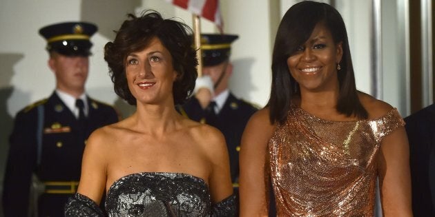 US First Lady Michelle Obama poses for a photo as she welcomes the wife of Italian Prime Minister, Agnese Landini, on the North Portico of the White House before a state dinner in Washington, DC on October 18, 2016. / AFP / Nicholas Kamm (Photo credit should read NICHOLAS KAMM/AFP/Getty Images)